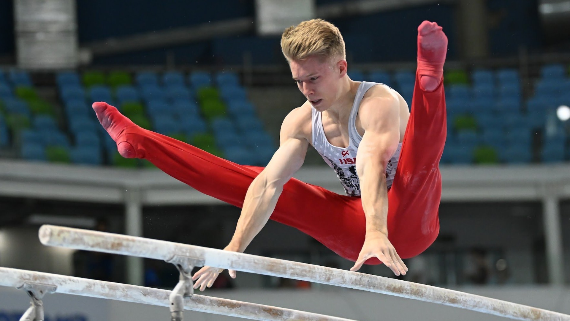 Shane Wiskus compete on parallel bars at the 2022 Pan American Championships.