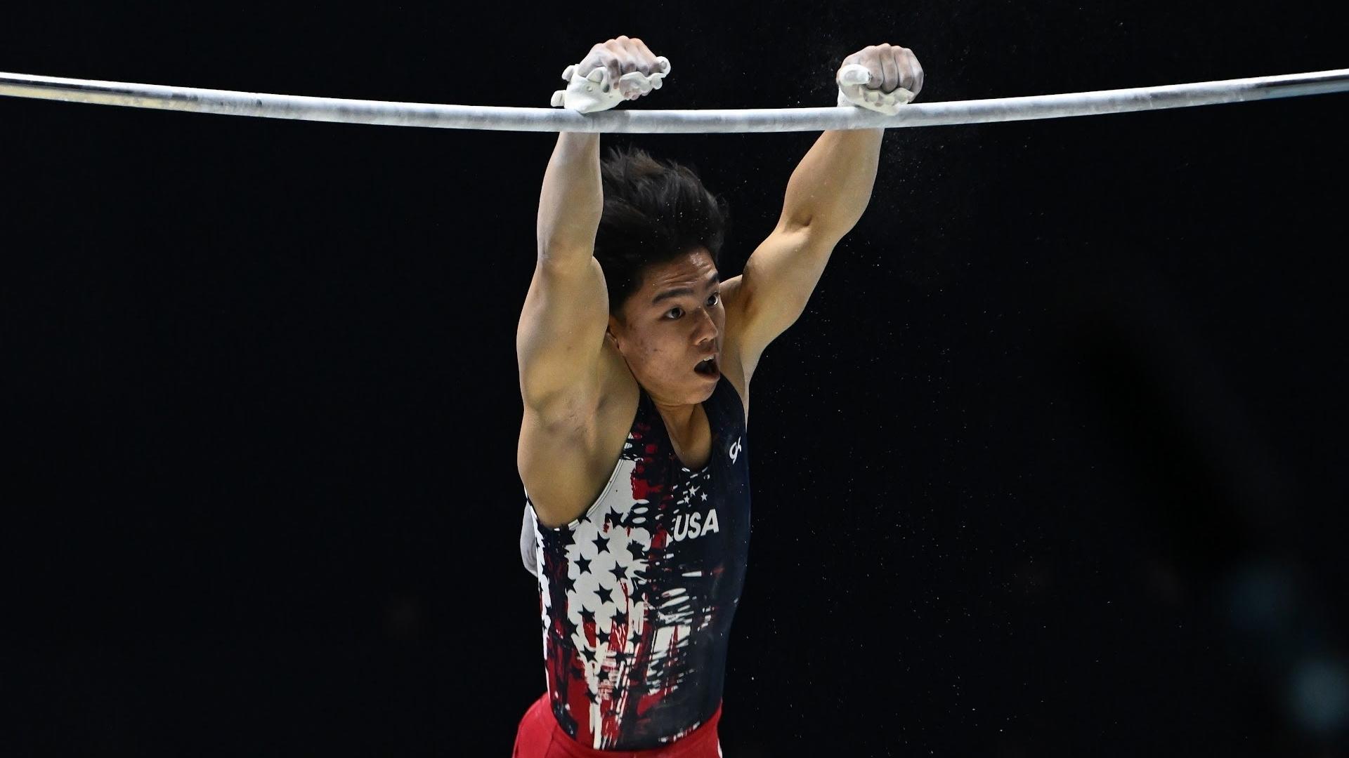 Asher Hong catches his Kolman release on high bar by his grips during the final rotation of the men's all-around final at the 2022 World Gymnastics Championships.