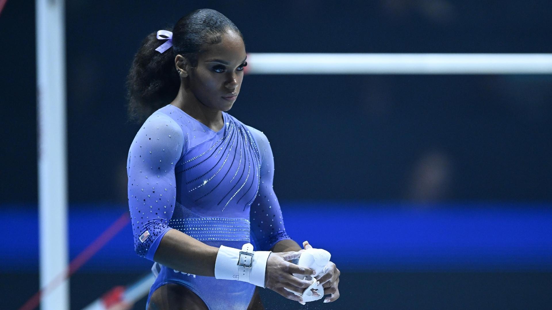 Shilese Jones (USA) chalks up before competing on bars during qualifying at the 2022 World Gymnastics Championships.
