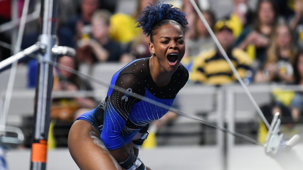Trinity Thomas celebrates following the conclusion of her uneven bars routine during the semifinals of the 2022 NCAA Women's Gymnastics Championships.