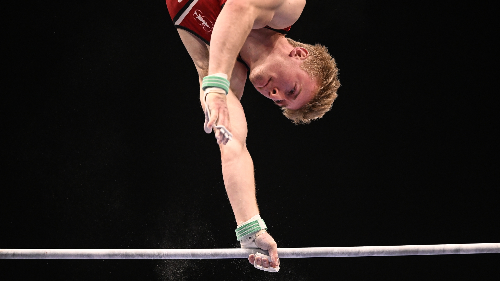 Stanford's Riley Loos swings high bar during the 2022 OOFOS U.S. Gymnastics Championships.