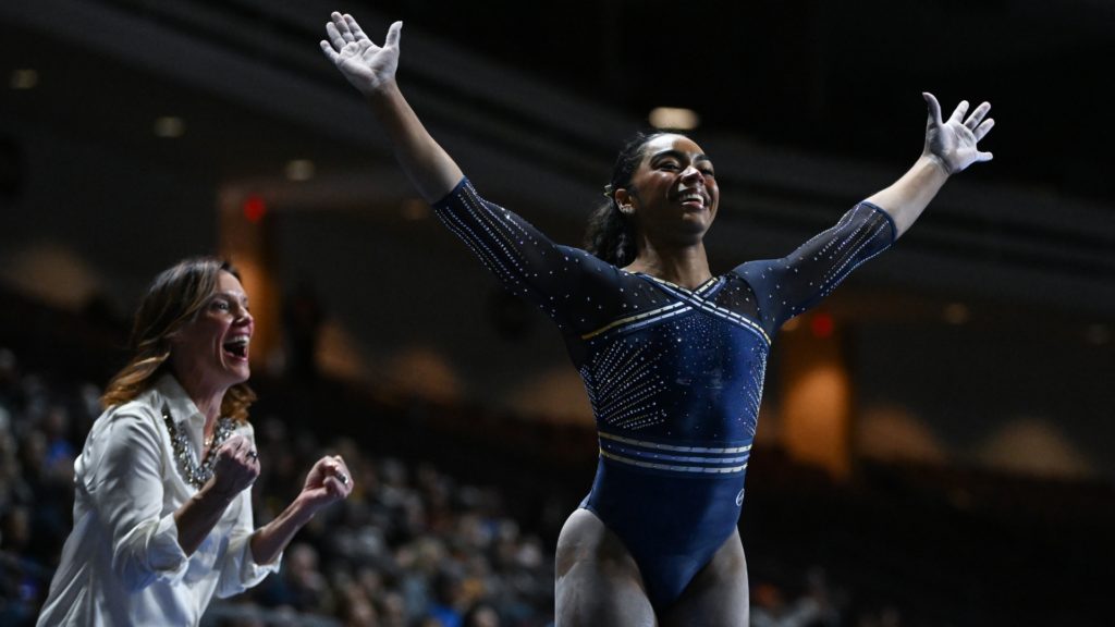 Cal's eMjae Frazier reacts after finishing her beam routine during the 2023 Super 16 meet.