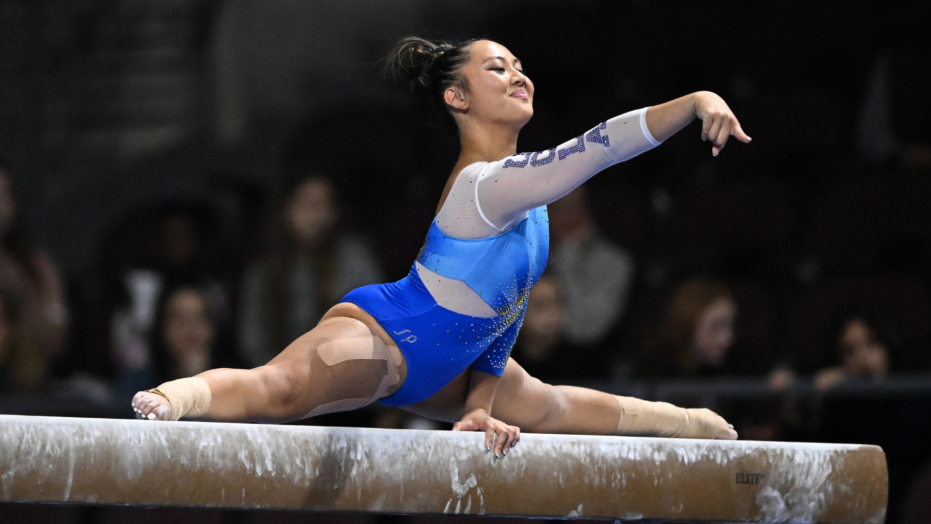 UCLA's Emma Malabuyo mounts the beam during the 2023 Super 16 meet.