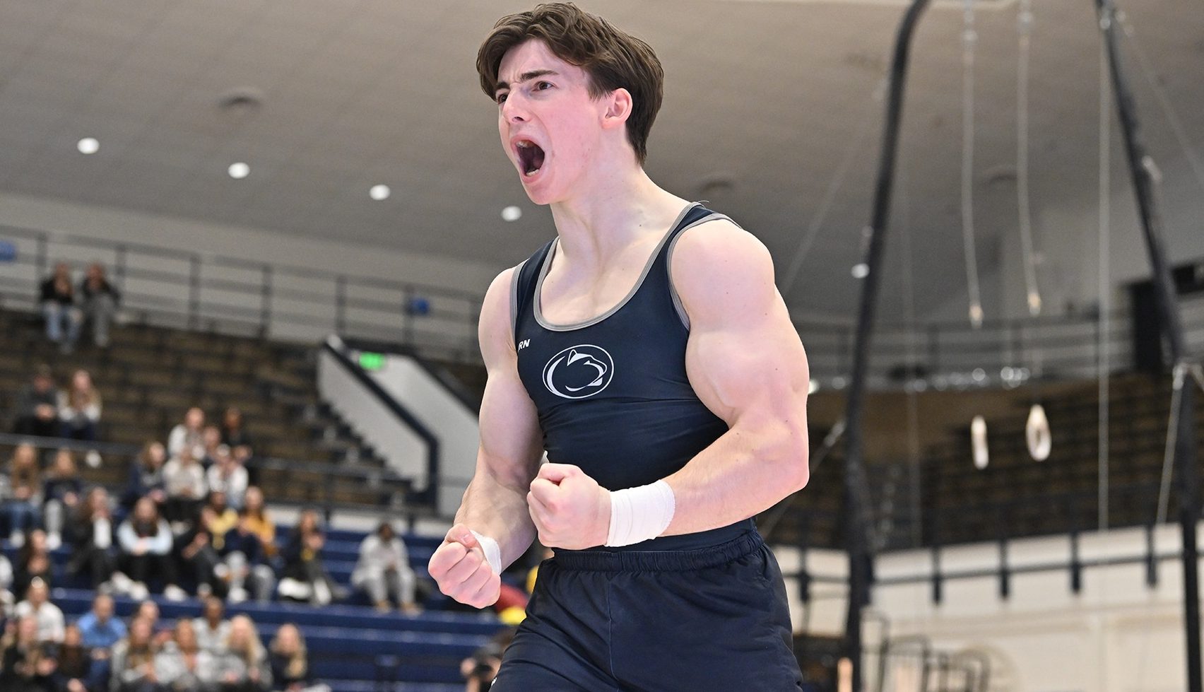 Penn State’s Matt Cormier celebrates after a routine against Michigan.