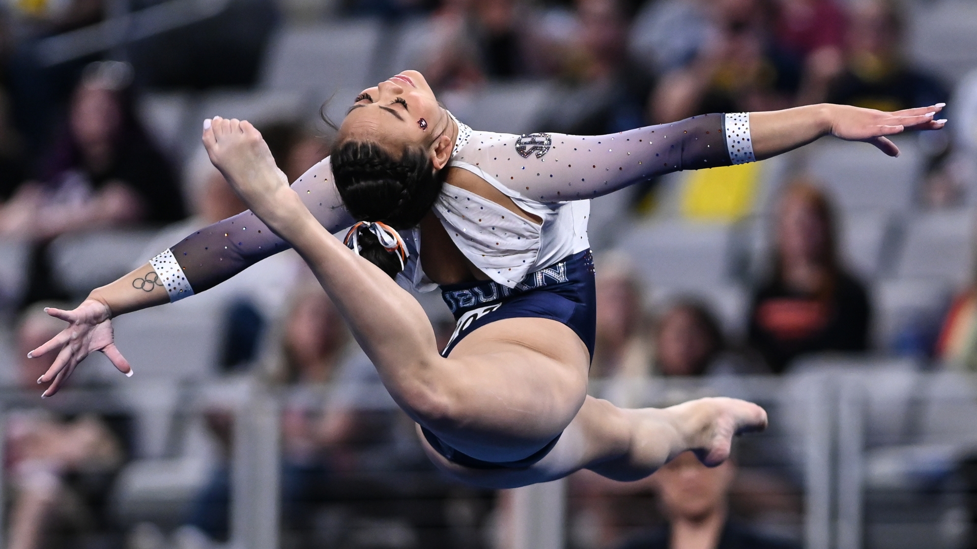 Auburn's Suni Lee performs on floor during the semifinals of the 2022 NCAA Women's Gymnastics Championships.