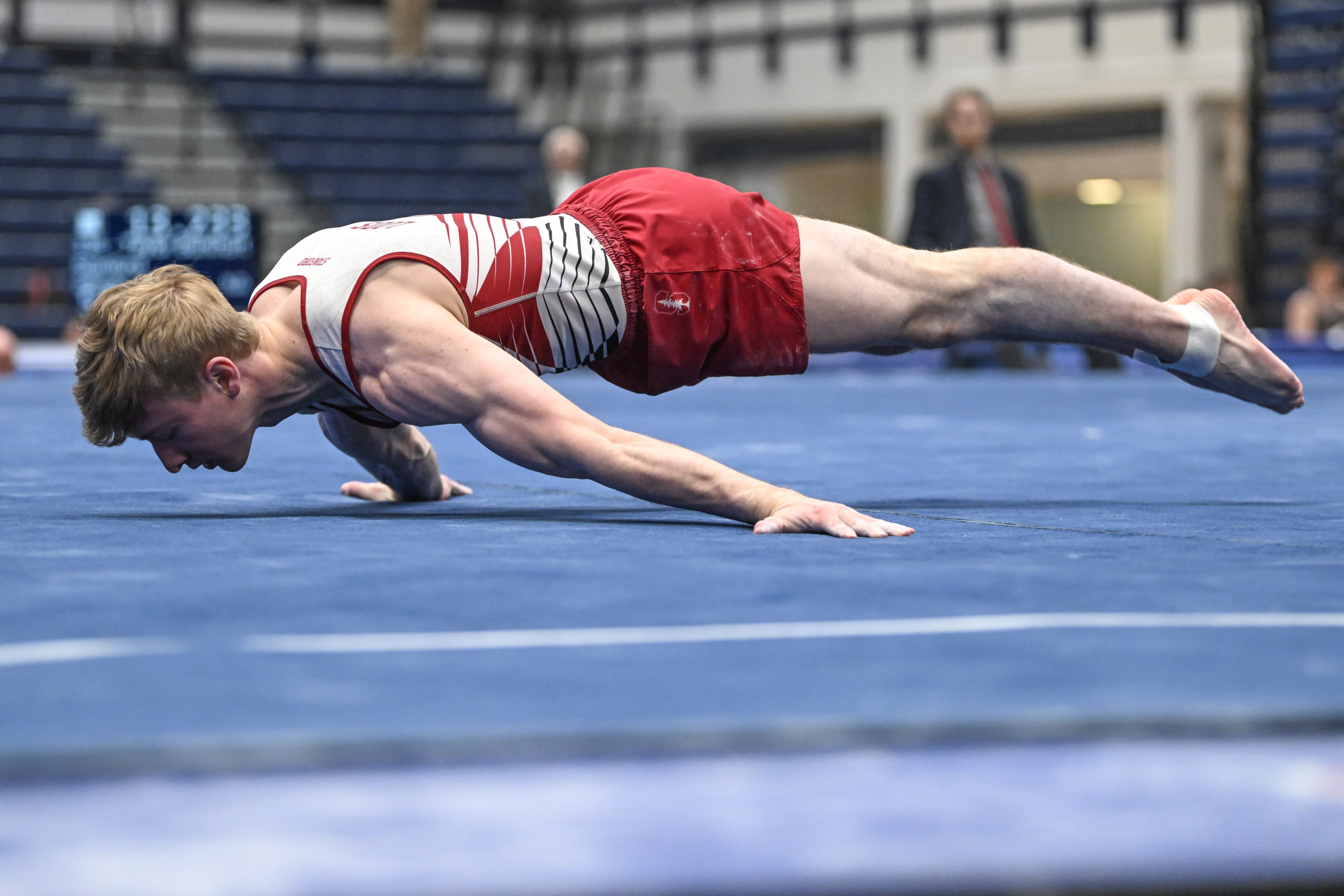 Stanford's Riley Loos performs a Maltese on floor during session 1 of pre-qualifying at the 2023 NCAA Men's Gymnastics Championships.
