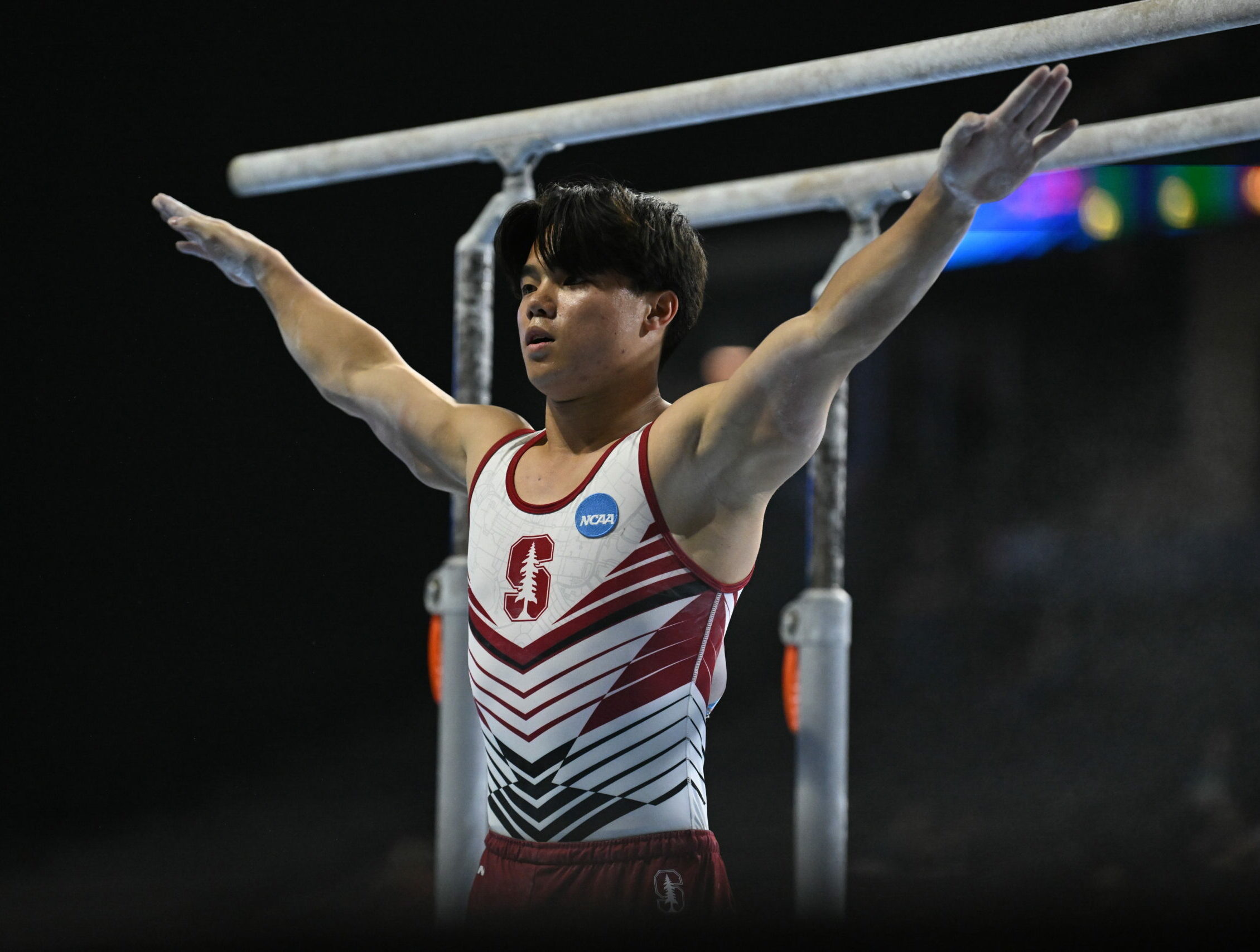 Asher Hong salutes while competing parallel bars during the 2023 Core Hydration Classic.