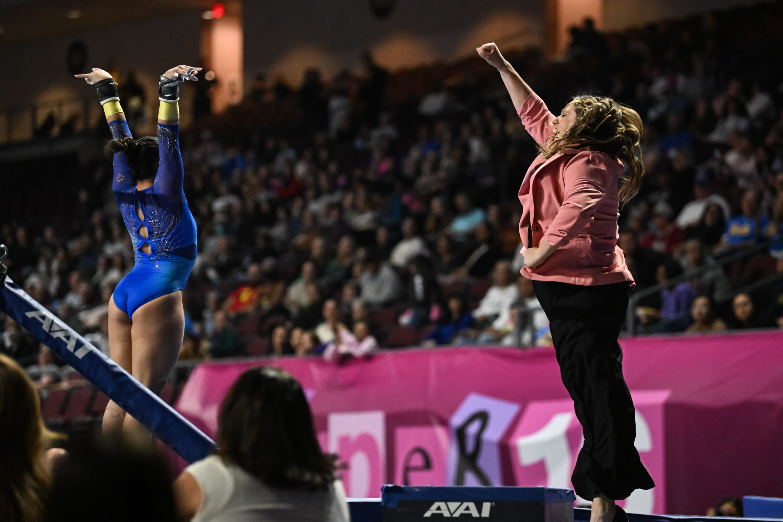 UCLA gymnastics head coach Janelle McDonald reacts after Emma Malabuyo’s bars routine at the 2024 Mean Girls Super 16.