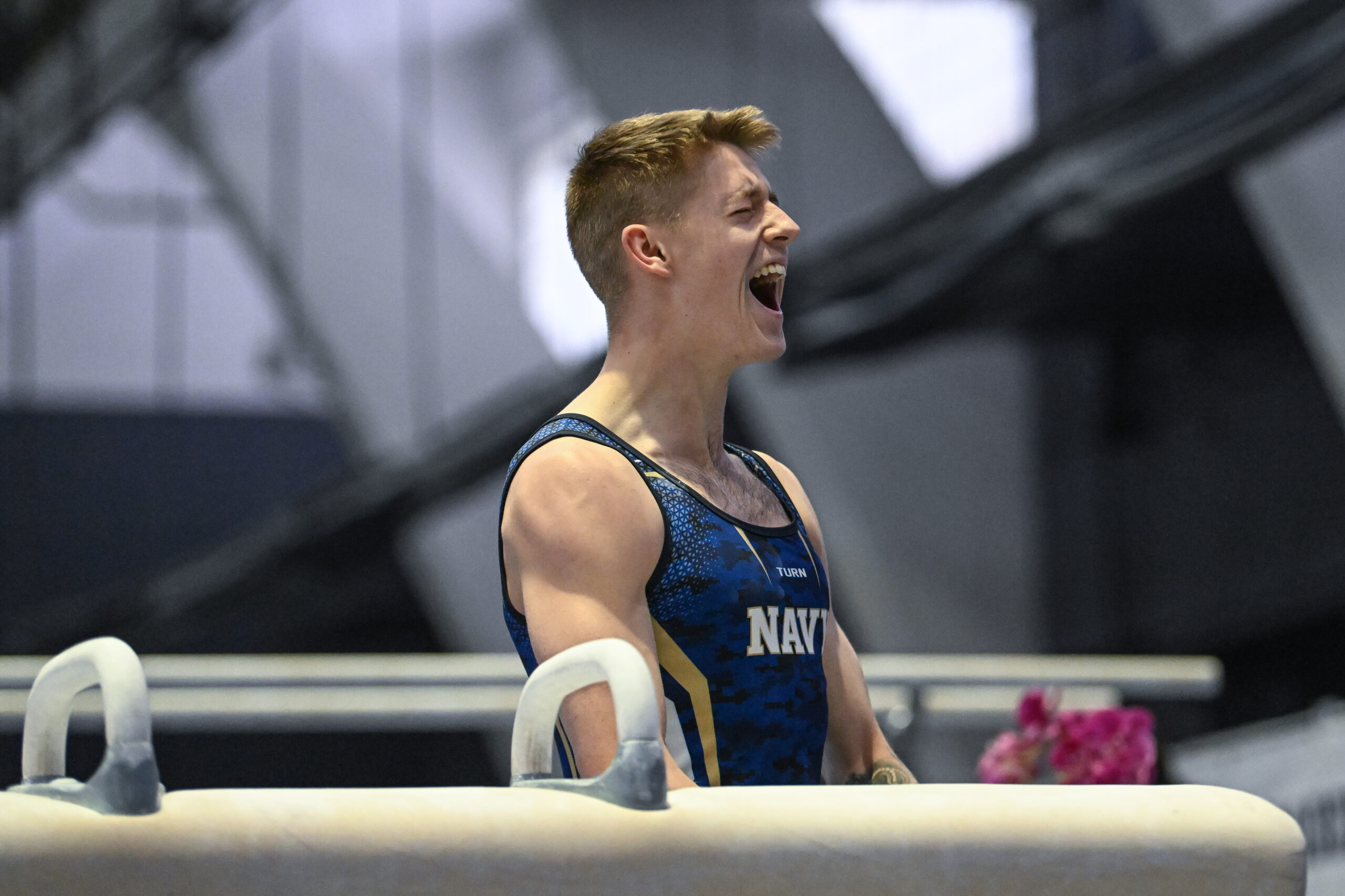 Navy's Ronan McQuillan reacts after dismounting pommel horse at the 2023 Navy Open.