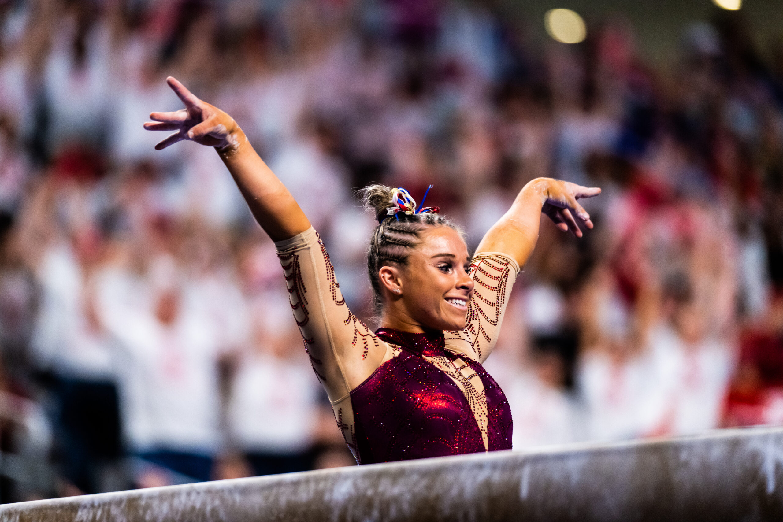 Oklahoma’s Ragan Smith salutes after dismounting beam at the 2023 NCAA Women’s Gymnastics Championships.