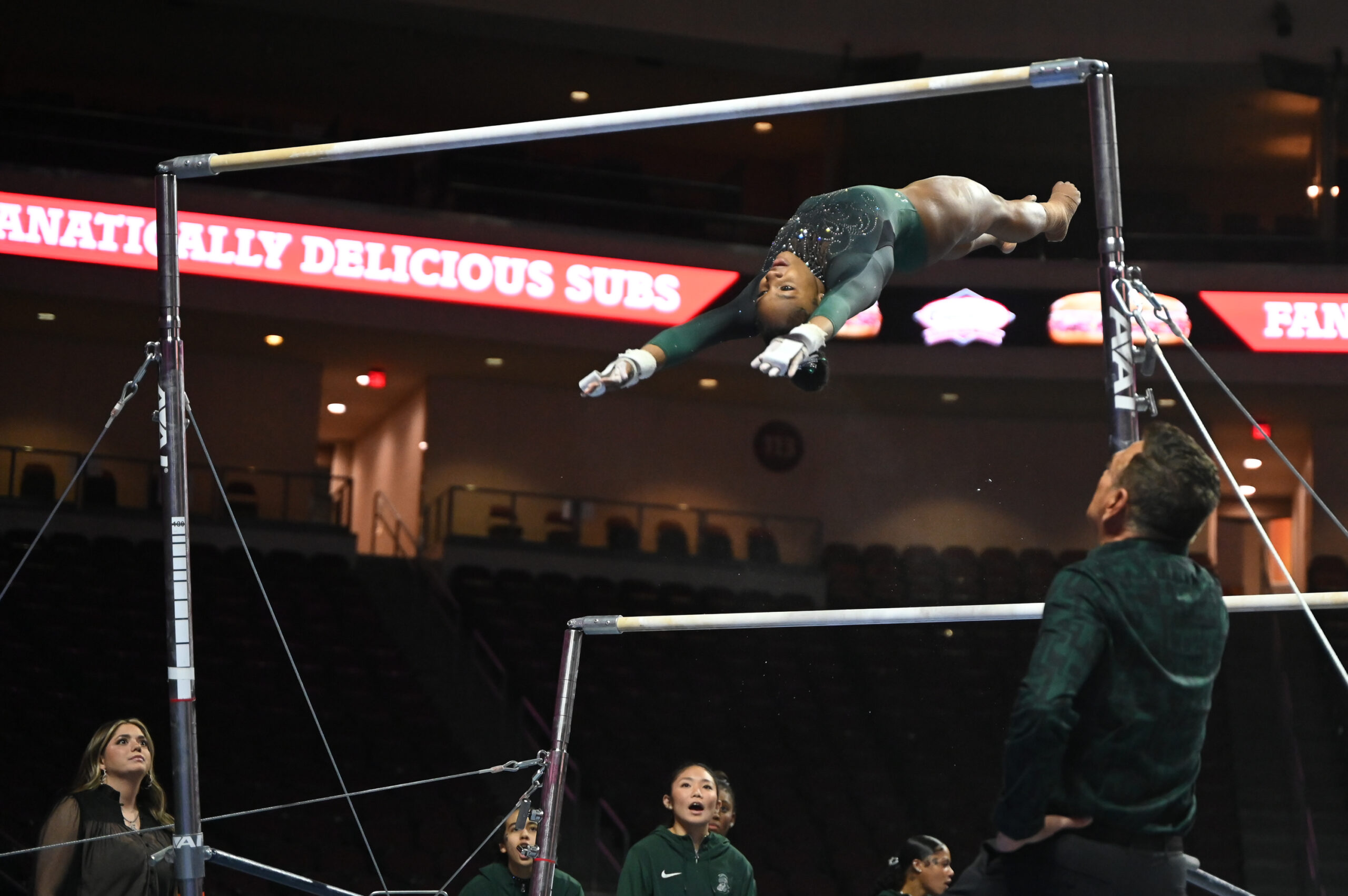Michigan State's Olivia Zsarmani on bars at the 2024 Mean Girls Super 16 meet.