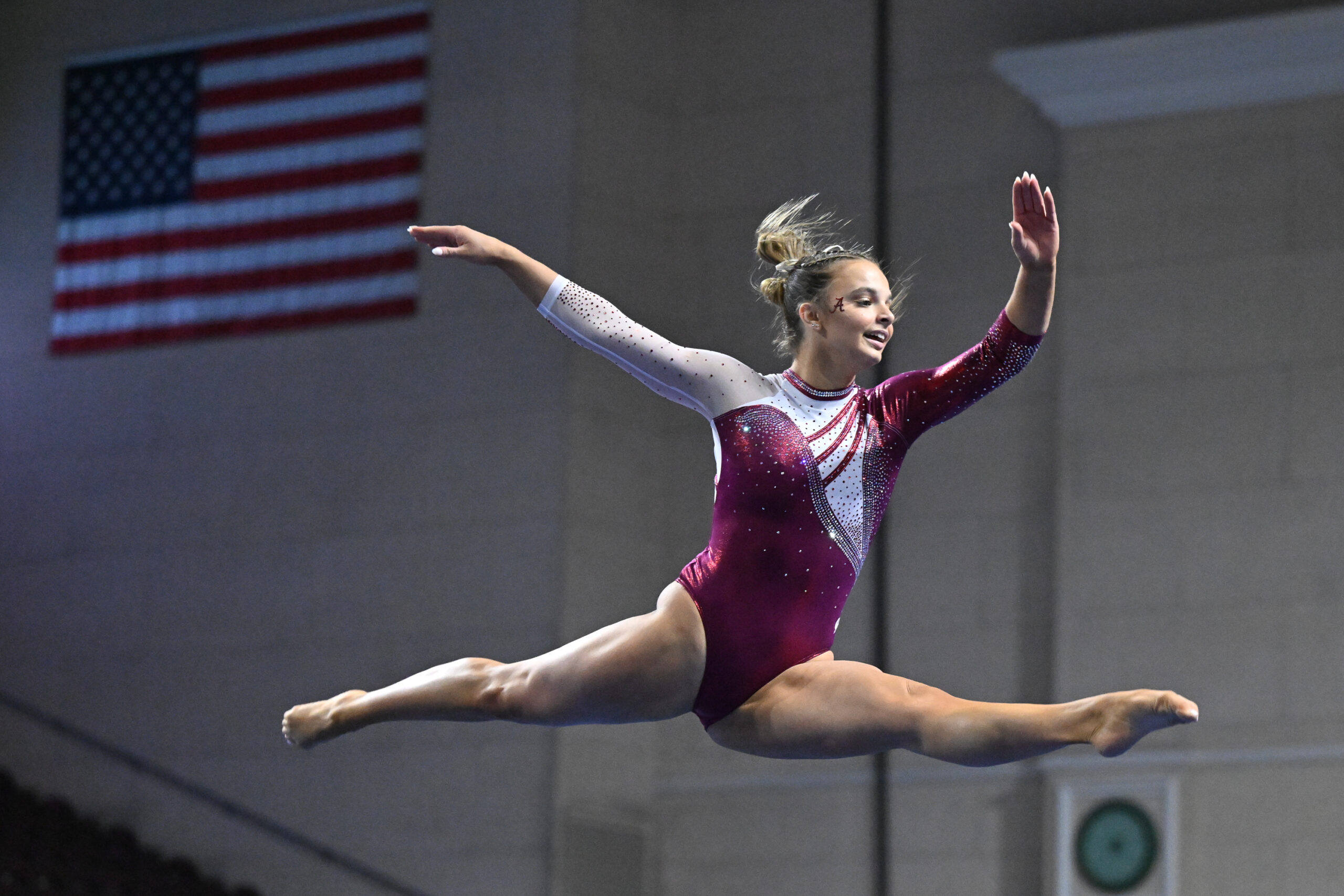 Alabama's Lilly Hudson on beam at the 2024 Mean Girls Super 16 meet.