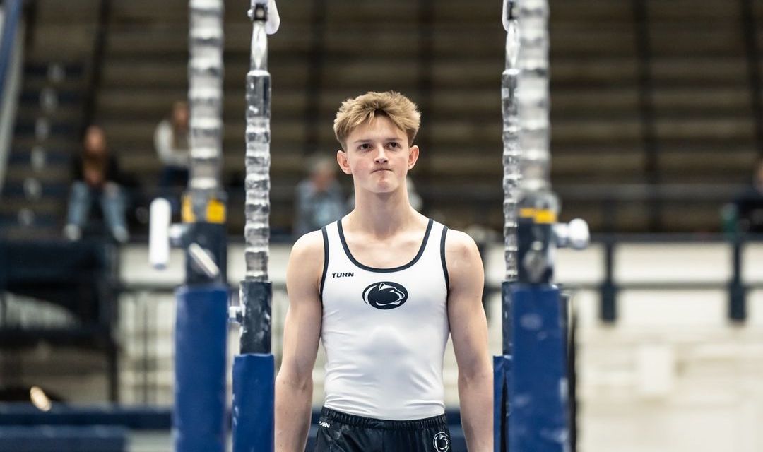 Kacper Garnczarek prepares to mount parallel bars at a Penn State men’s gymnastics meet.