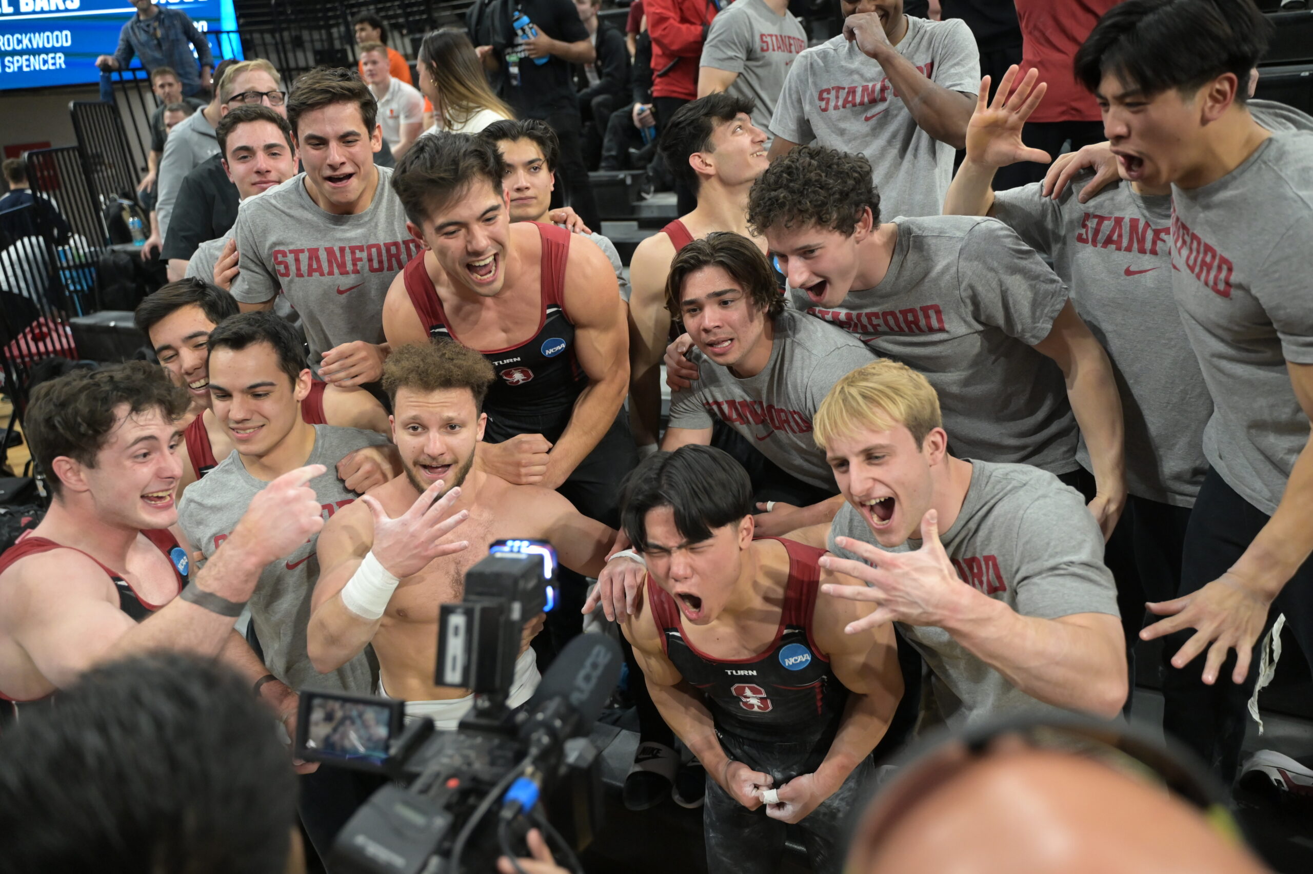 The Stanford men's gymnastics team celebrates winning the 2024 NCAA Men's Gymnastics Championships.