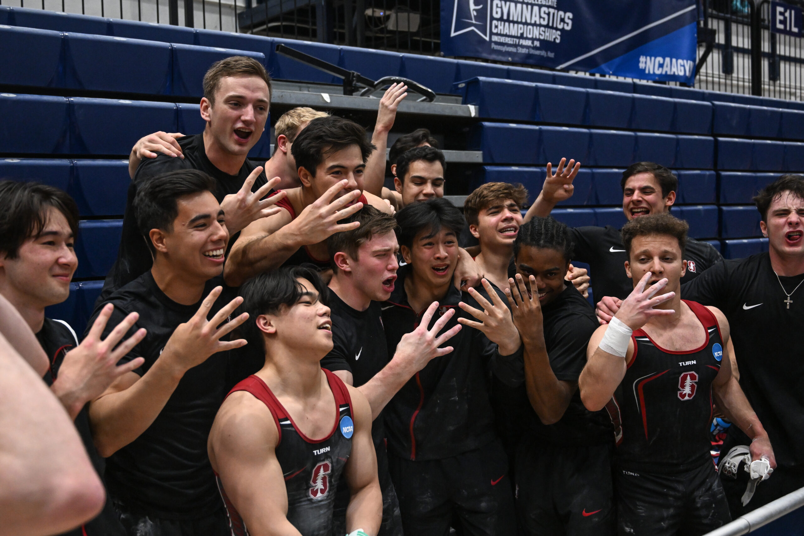 The Stanford men's gymnastics team celebrates its fourth straight title at the 2023 NCAA Men's Gymnastics Championships.
