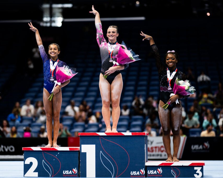 The junior women's podium at the 2025 Xfinity U.S. Gymnastics Championships: (left to right) Isabella Anzola (WOGA), Caroline Moreau (Texas Dreams), and Amia Pugh-Banks (World Class).