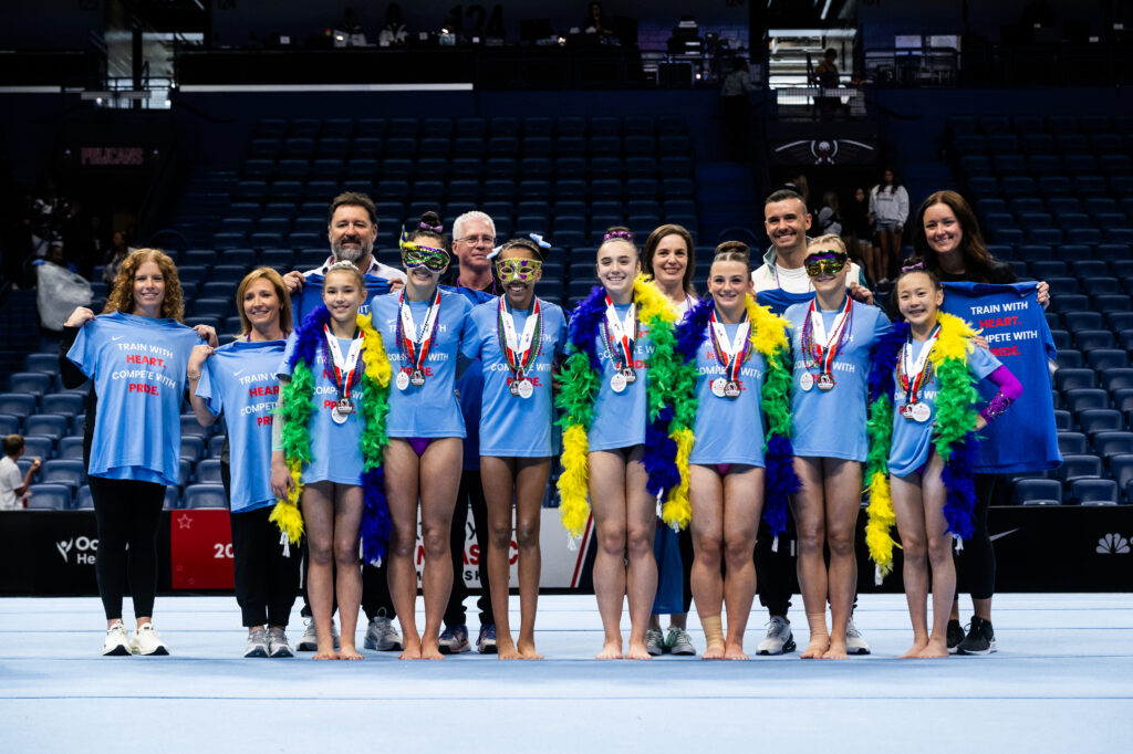 Squad Showdown winner Team London, including Moreau, Kylie Smith (Cincinnati), Addalye VanGrinsven (Pacific Reign), Addy Fulcher (Georgia Elite), Sydney Williams (Metroplex), Elaina Sliney (Cincinnati), Espy Chang (Pacific Reign), and coaches.