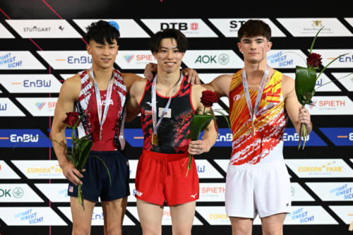 The senior men's floor exercise podium at the 2023 DTB Pokal. From left to right: silver medalist Yul Moldauer (USA), gold medalist Doi Ryosuke (JPN), and bronze medalist Pau Jimenez Fernandez (ESP). (© Filippo Tomasi)