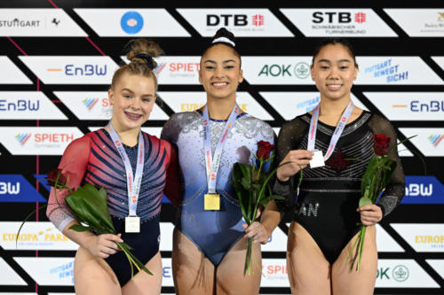 The senior women's floor exercise podium at the 2023 DTB Pokal. From left to right: silver medalist Joscelyn Roberson (USA), gold medalist Julia Soares (BRA), and bronze medalist Aurelie Tran (CAN). (© Filippo Tomasi)