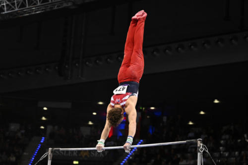 Landen Blixt (Michigan) competes on high bar during the 2023 DTB Pokal Mixed Cup. (© Filippo Tomasi)